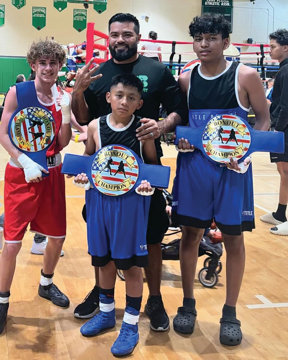 On Saturday, March 23rd, three of our athletes participated in the USA Boxing Lake Placid BOXOFF. Pictured left is Dyllyn Heasley with his 5th consecutive win. Bottom center is Dylan Sanchez Hernandez and top row center is Head Coach Manuel Sanchez. On the right is Jacob Chavez.. All the three athletes secured a unanimous decision win over their opponents and won the BOXOFF Championship belt in their respective divisions. [Courtesy photo]